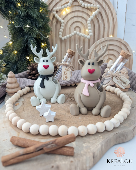 D-gedrucktes Rentier mit Reagenzglas und Schal in rosa, schwarz oder blau als Geldgeschenk im Scandi-Weihnachtsstil.